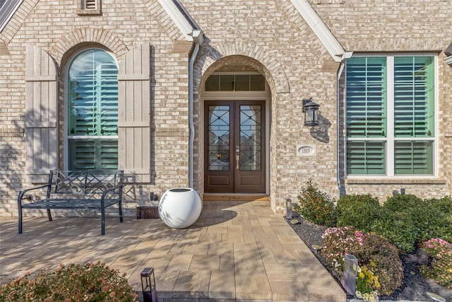 view of exterior entry featuring french doors