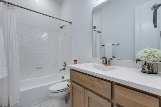 full bathroom with shower / tub combo with curtain, vanity, and toilet