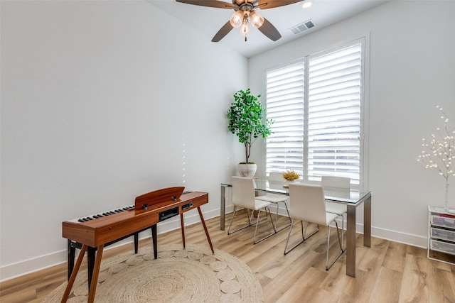 office with ceiling fan and light hardwood / wood-style floors