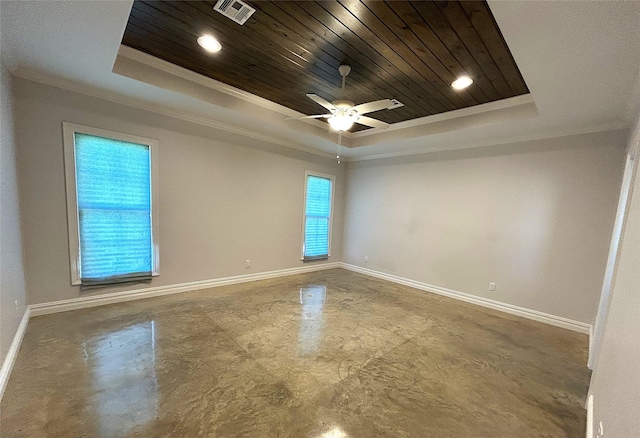 spare room with crown molding, wood ceiling, ceiling fan, concrete flooring, and a raised ceiling