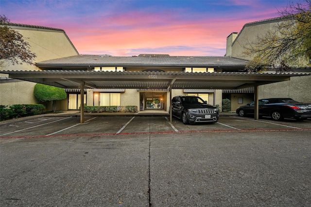 parking at dusk with a carport