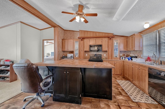 kitchen with a textured ceiling, sink, black appliances, a center island, and lofted ceiling