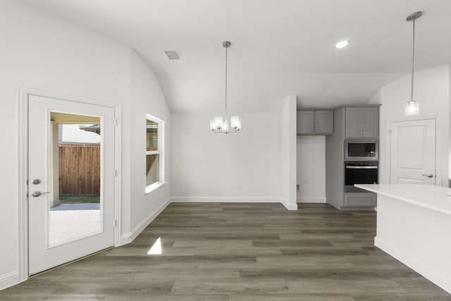 216 Hope Orchards, Lavon, TX 75166 - unfurnished dining area with a chandelier, lofted ceiling, dark wood finished floors, recessed lighting, and baseboards