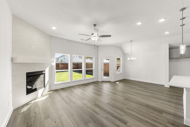 216 Hope Orchards, Lavon, TX 75166 - unfurnished living room with a tiled fireplace, ceiling fan, baseboards, dark wood finished floors, and recessed lighting