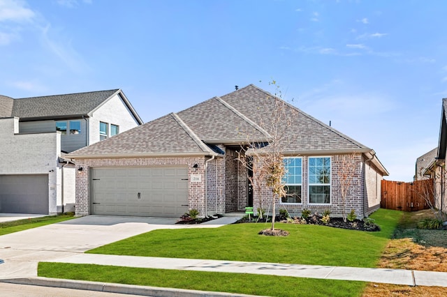 216 Hope Orchards, Lavon, TX 75166 - view of front facade with driveway, a garage, brick siding, and a shingled roof