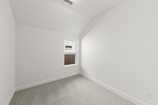 216 Hope Orchards, Lavon, TX 75166 - spare room featuring carpet flooring, lofted ceiling, and baseboards