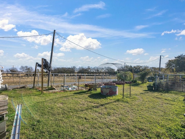 view of yard with a rural view