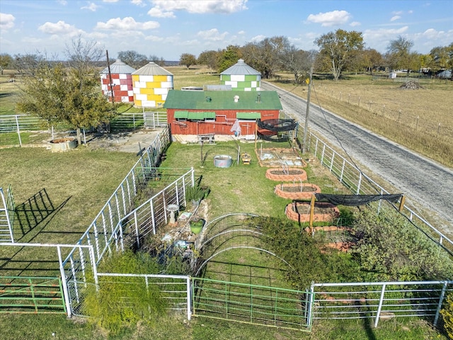 birds eye view of property featuring a rural view