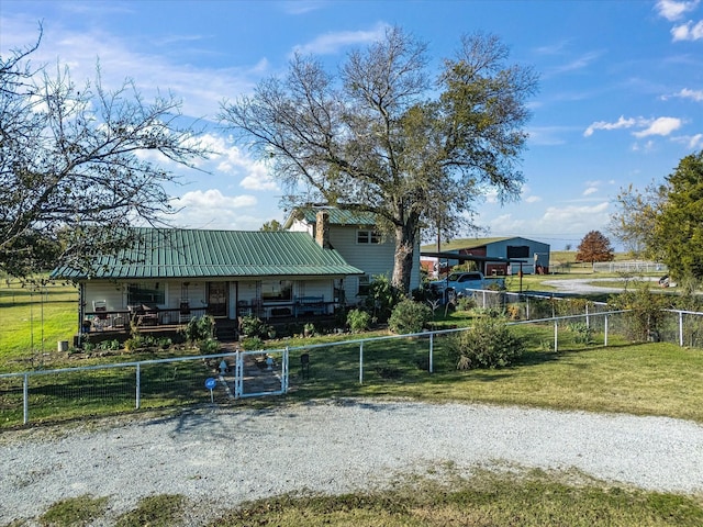 view of yard featuring covered porch