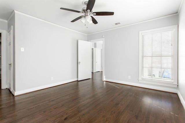 spare room with crown molding, ceiling fan, and dark wood-type flooring