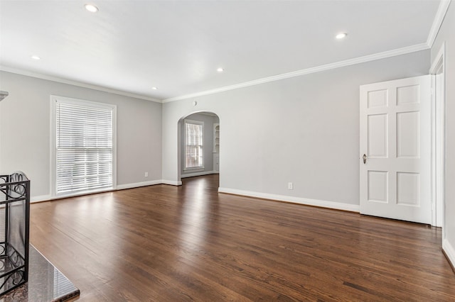 unfurnished living room featuring dark hardwood / wood-style floors and crown molding