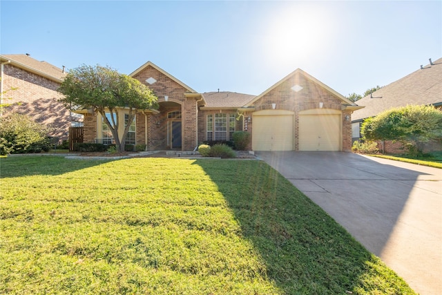 view of front of home with a front yard and a garage