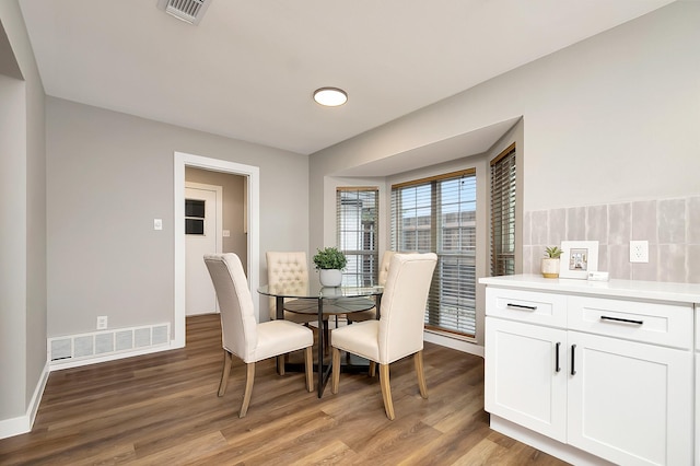 dining area with hardwood / wood-style flooring