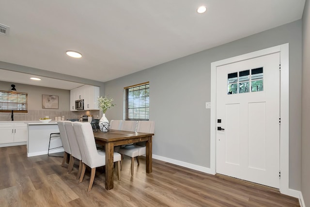 dining room with light wood-type flooring