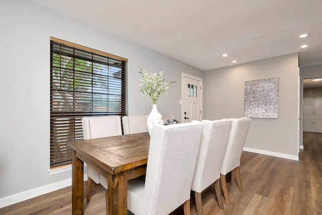 dining room with hardwood / wood-style floors