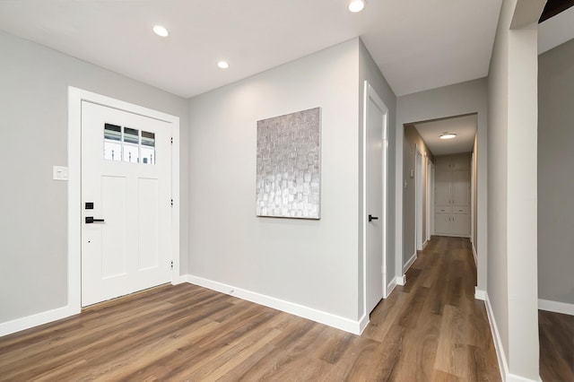 entryway with hardwood / wood-style flooring