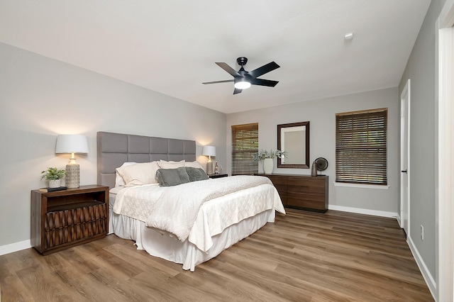 bedroom featuring light hardwood / wood-style flooring and ceiling fan