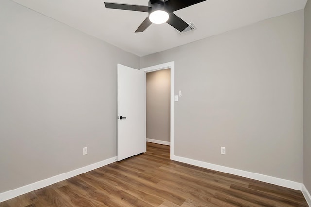 unfurnished room featuring ceiling fan and wood-type flooring