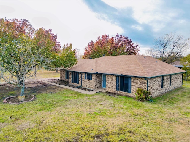 ranch-style house with a front lawn