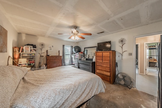 bedroom with ceiling fan and concrete flooring