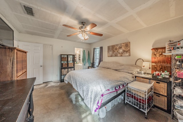 bedroom with ceiling fan and concrete floors