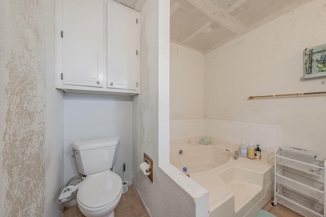 bathroom with toilet and a bathtub