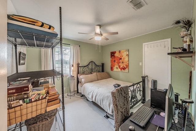 bedroom with concrete floors and ceiling fan