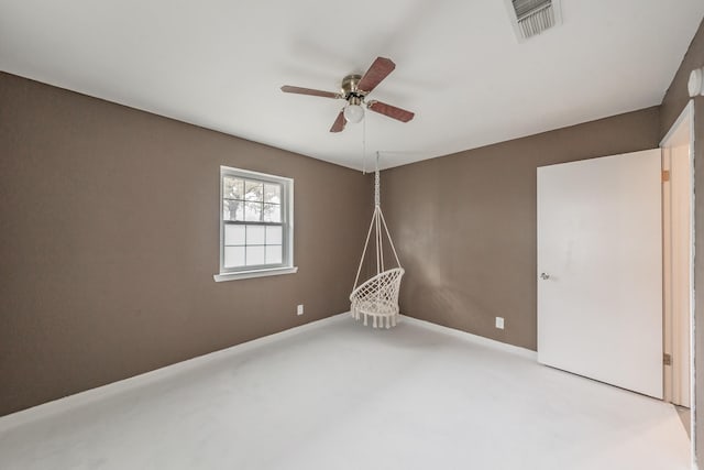 empty room featuring carpet flooring and ceiling fan