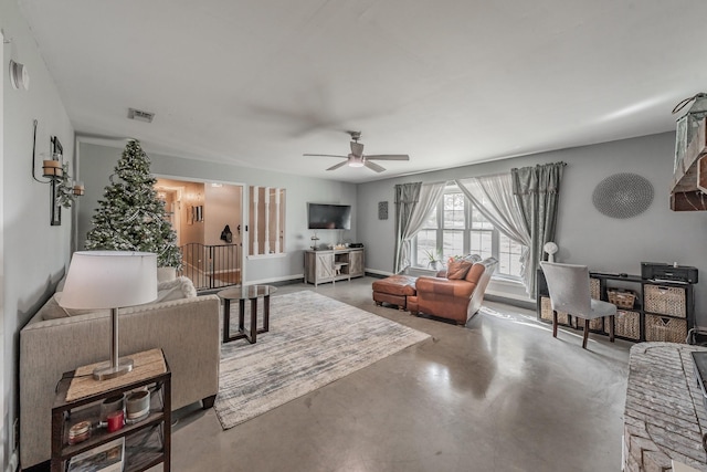 living room with concrete floors and ceiling fan