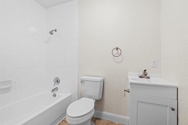 full bathroom with toilet, vanity, and tiled shower / bath