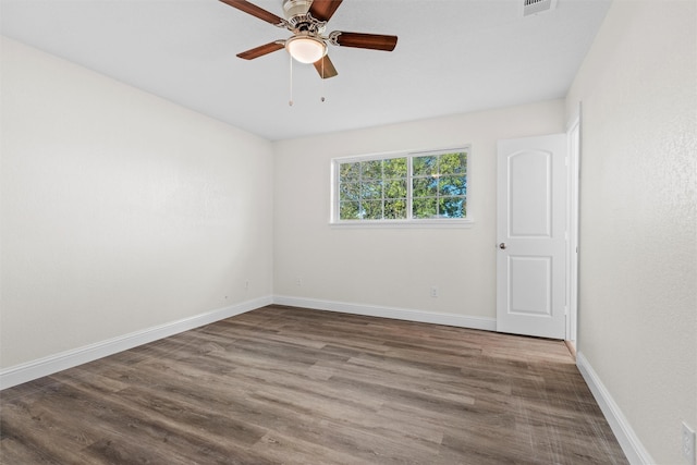 unfurnished room with hardwood / wood-style flooring and ceiling fan