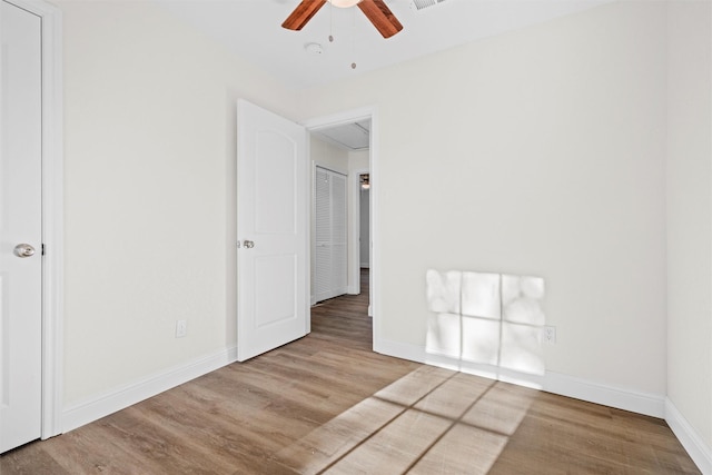 unfurnished room featuring ceiling fan and light wood-type flooring