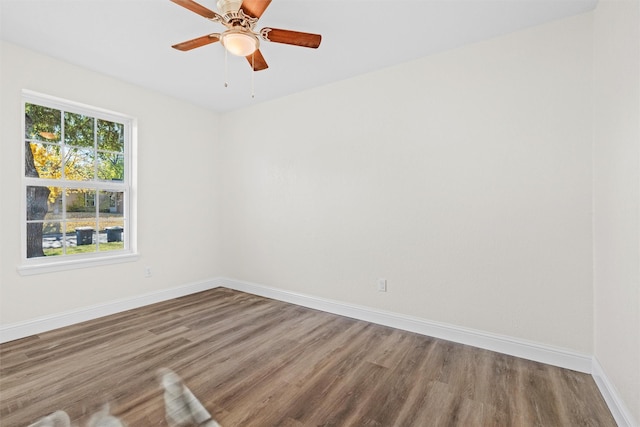 empty room featuring hardwood / wood-style floors and ceiling fan