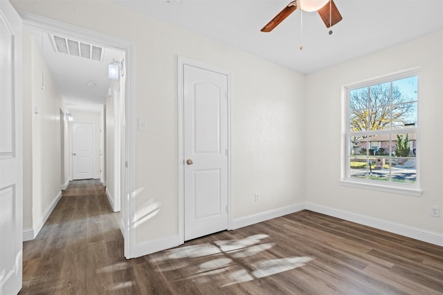 unfurnished bedroom with dark hardwood / wood-style floors