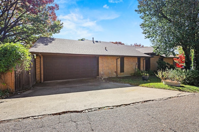 single story home with a garage