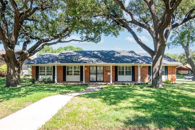 ranch-style home with a front lawn