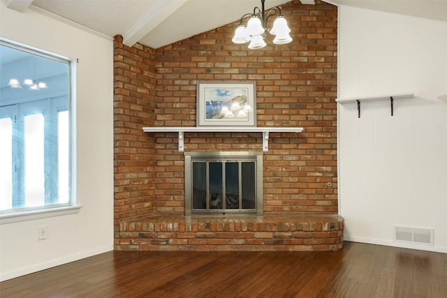 unfurnished living room with a brick fireplace, vaulted ceiling with beams, dark hardwood / wood-style floors, and an inviting chandelier