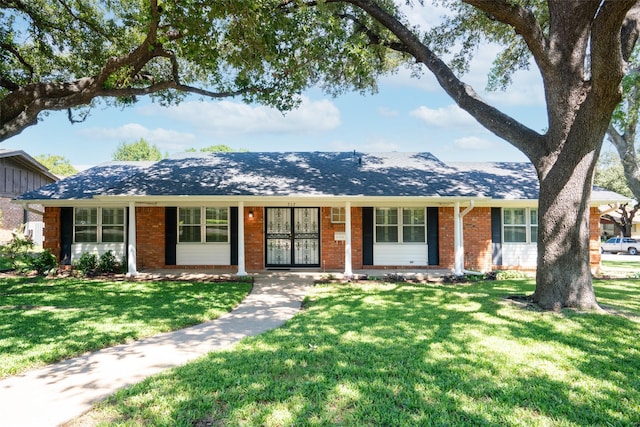 ranch-style house with a front lawn