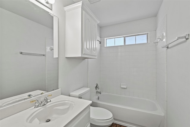 full bathroom with vanity, toilet, and tiled shower / bath