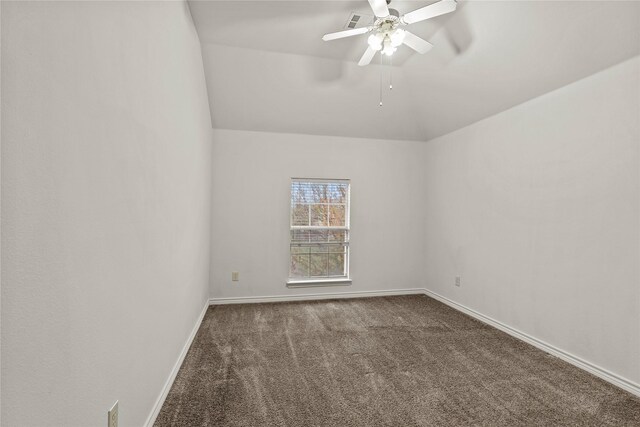 carpeted empty room featuring ceiling fan and lofted ceiling