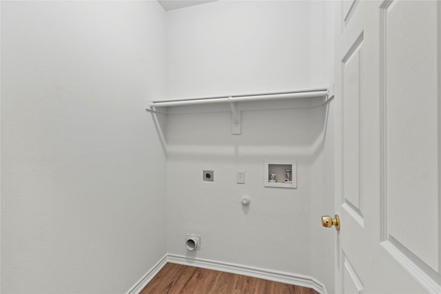 clothes washing area featuring hookup for a washing machine, dark hardwood / wood-style floors, gas dryer hookup, and electric dryer hookup