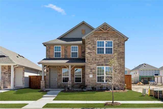 craftsman inspired home with a front yard