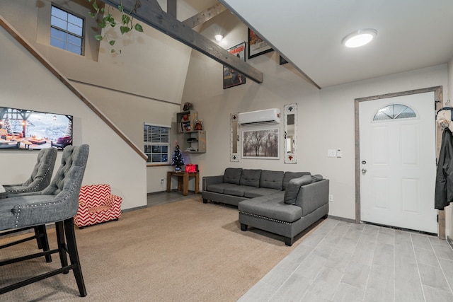 living room featuring a wall mounted AC and a towering ceiling