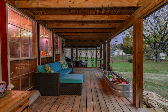 wooden terrace featuring a yard