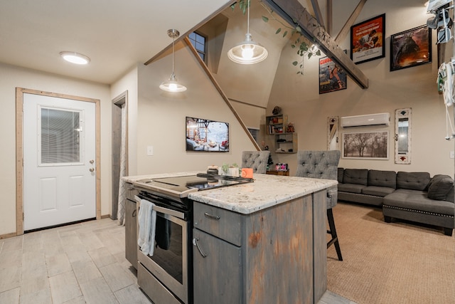 kitchen featuring appliances with stainless steel finishes, a wall mounted AC, light hardwood / wood-style floors, decorative light fixtures, and french doors