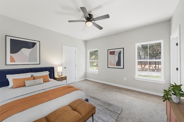 bedroom with ceiling fan and carpet flooring