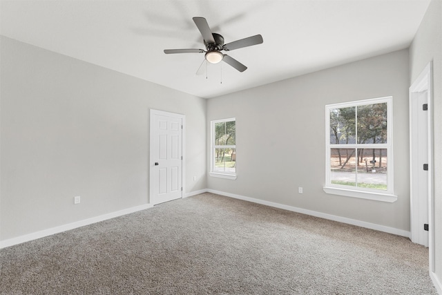 unfurnished room with ceiling fan and carpet floors