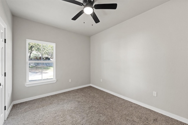 carpeted empty room featuring ceiling fan