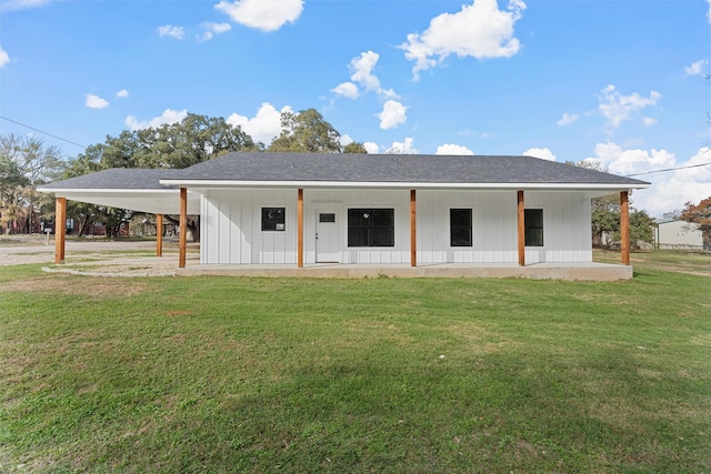 rear view of house with a lawn