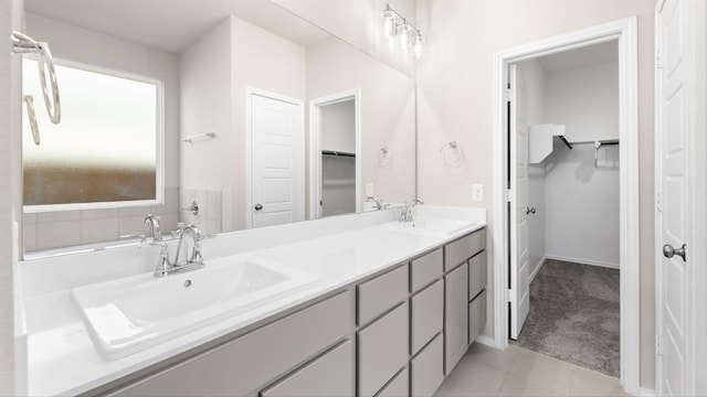 bathroom with tile patterned floors and vanity